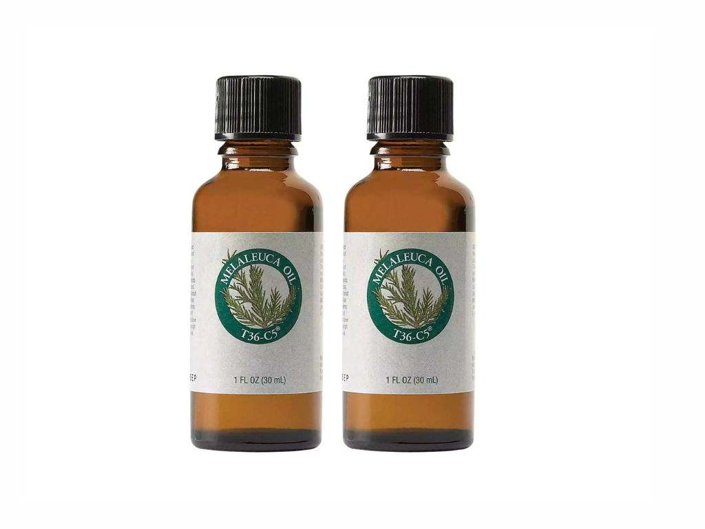 two bottles of a tea tree oil on a white background