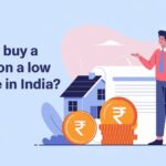 "Illustration of a man with a briefcase pointing at a house, with a document and rupee coins in front, promoting how to buy a house on a low income in India."